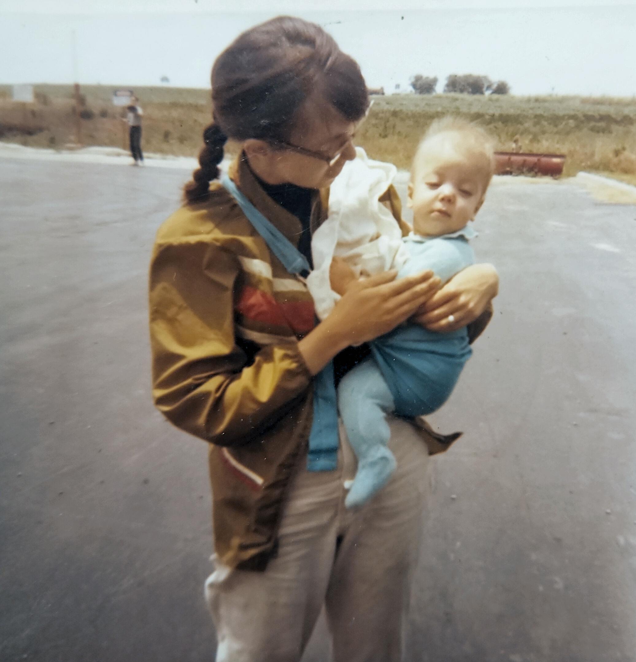 A woman holding a baby