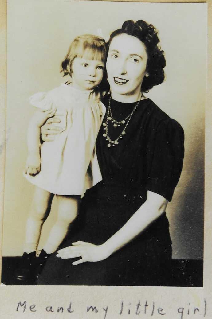 A woman holding a child