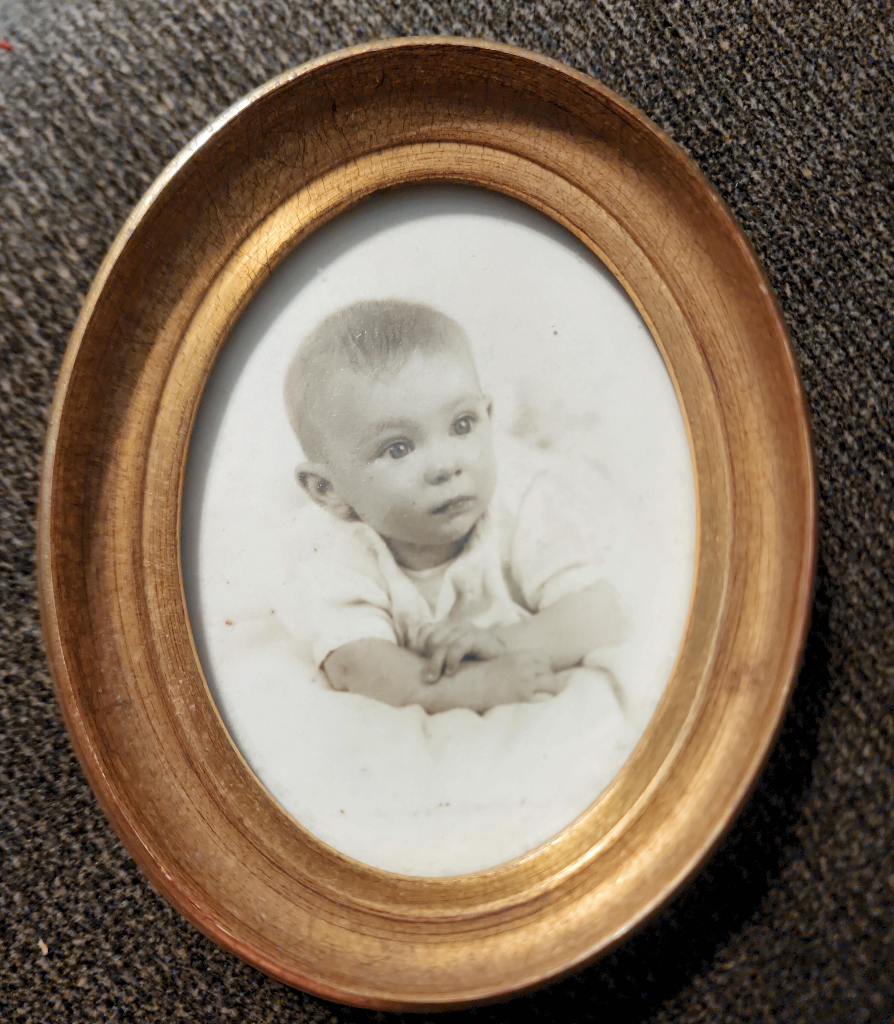 A picture frame with a baby in it