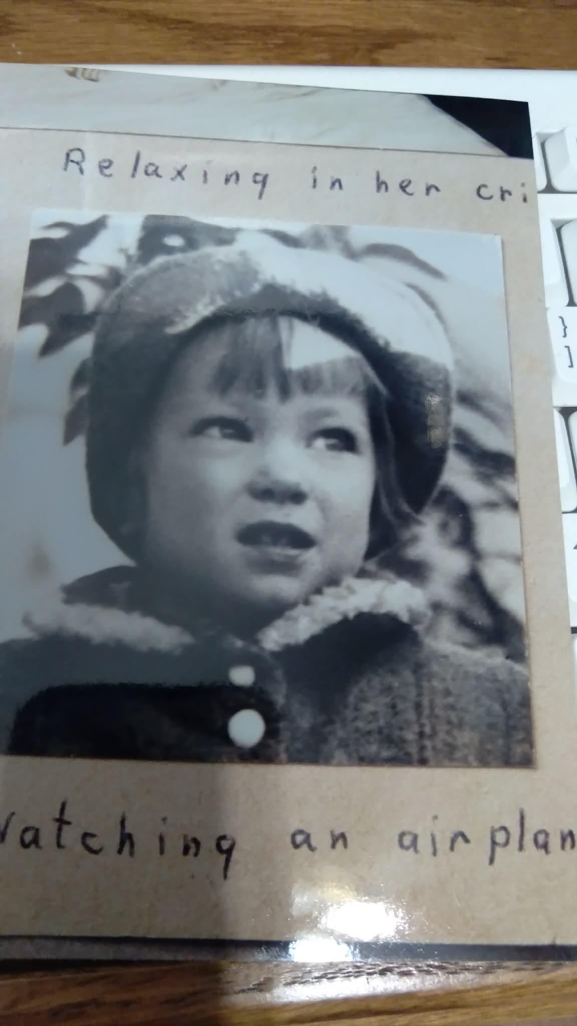 A black and white photo of a child