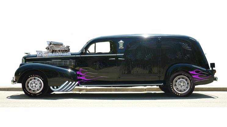 A black car with a chrome engine