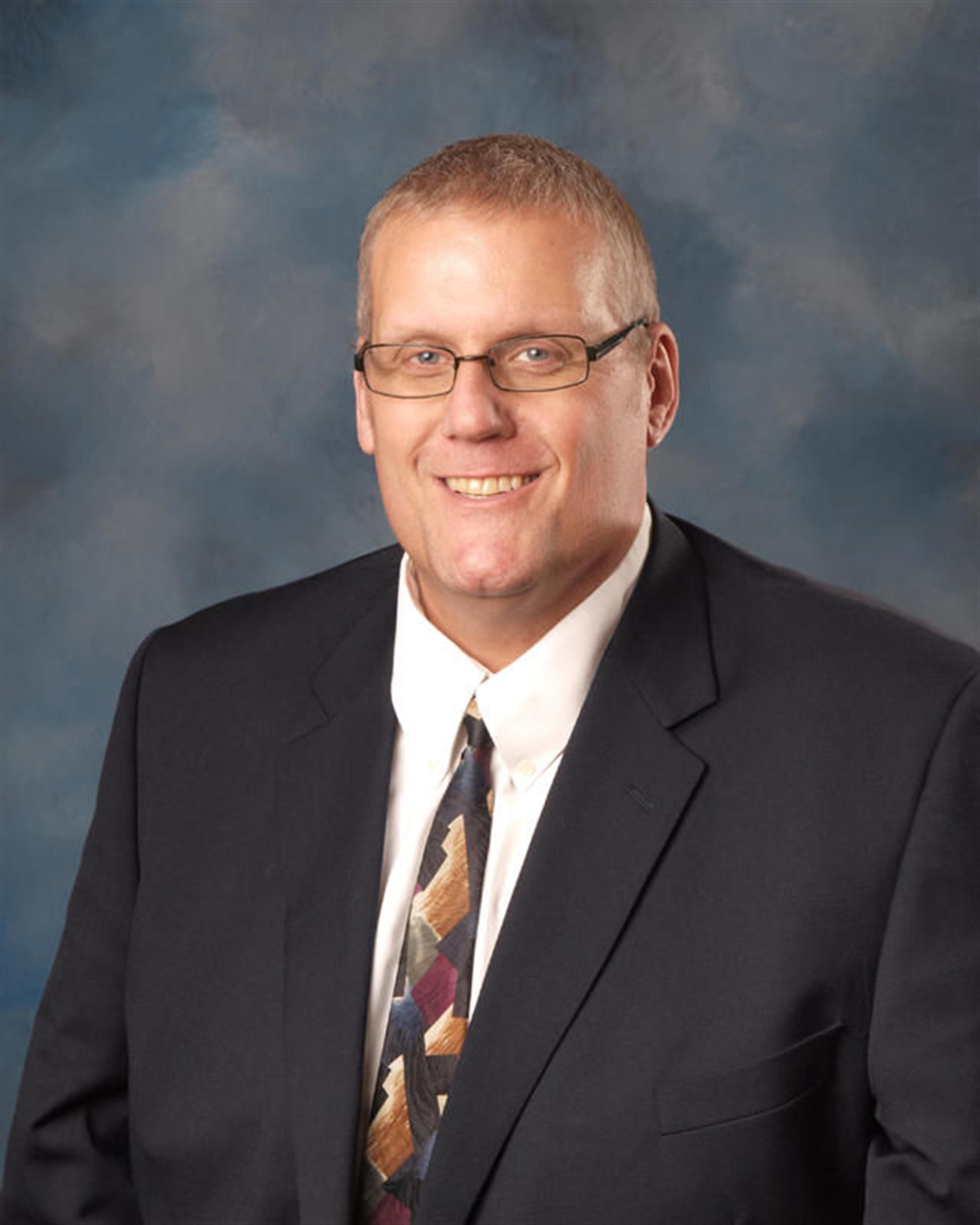 Mr. Justin Springer