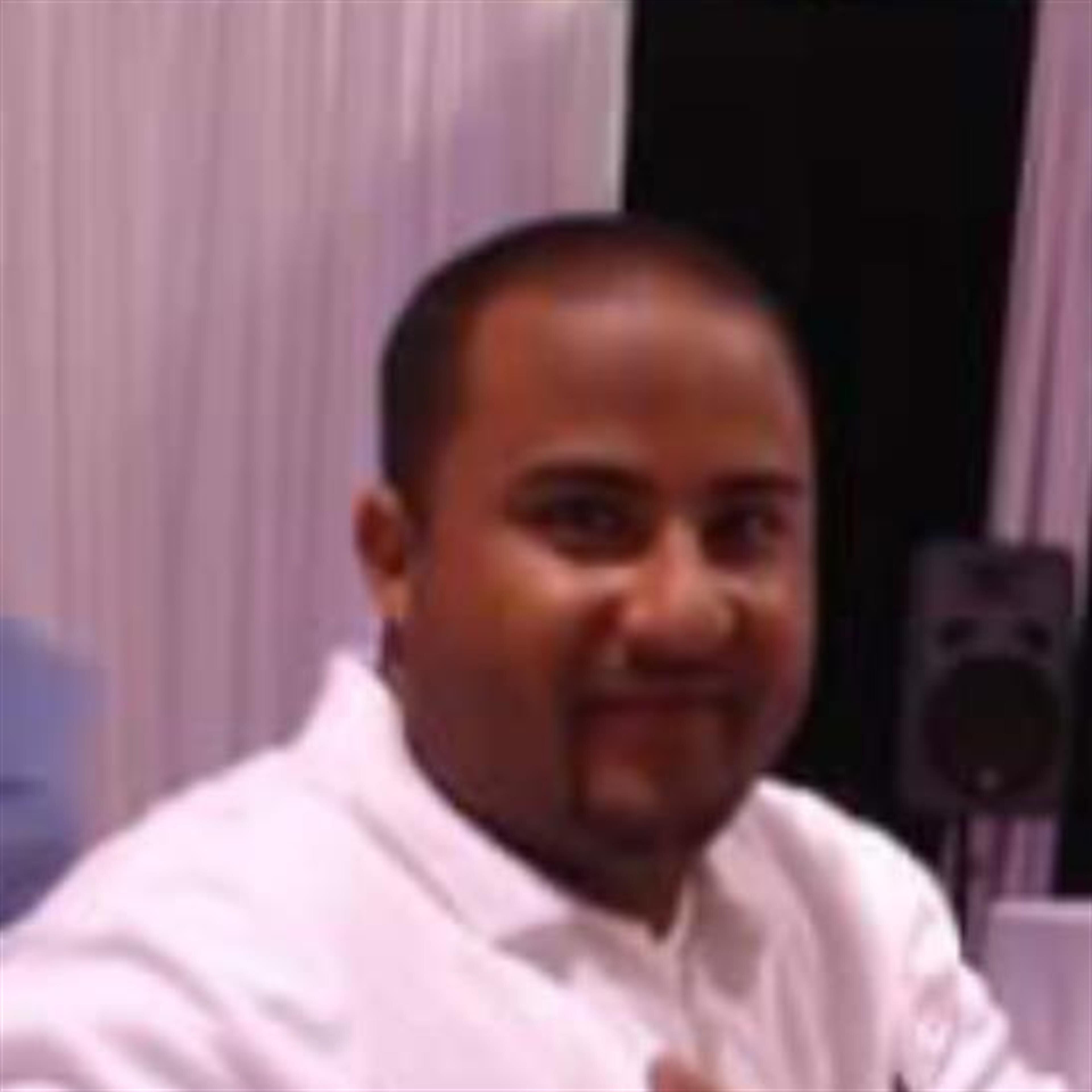 George E. " BUDHA " Ramirez