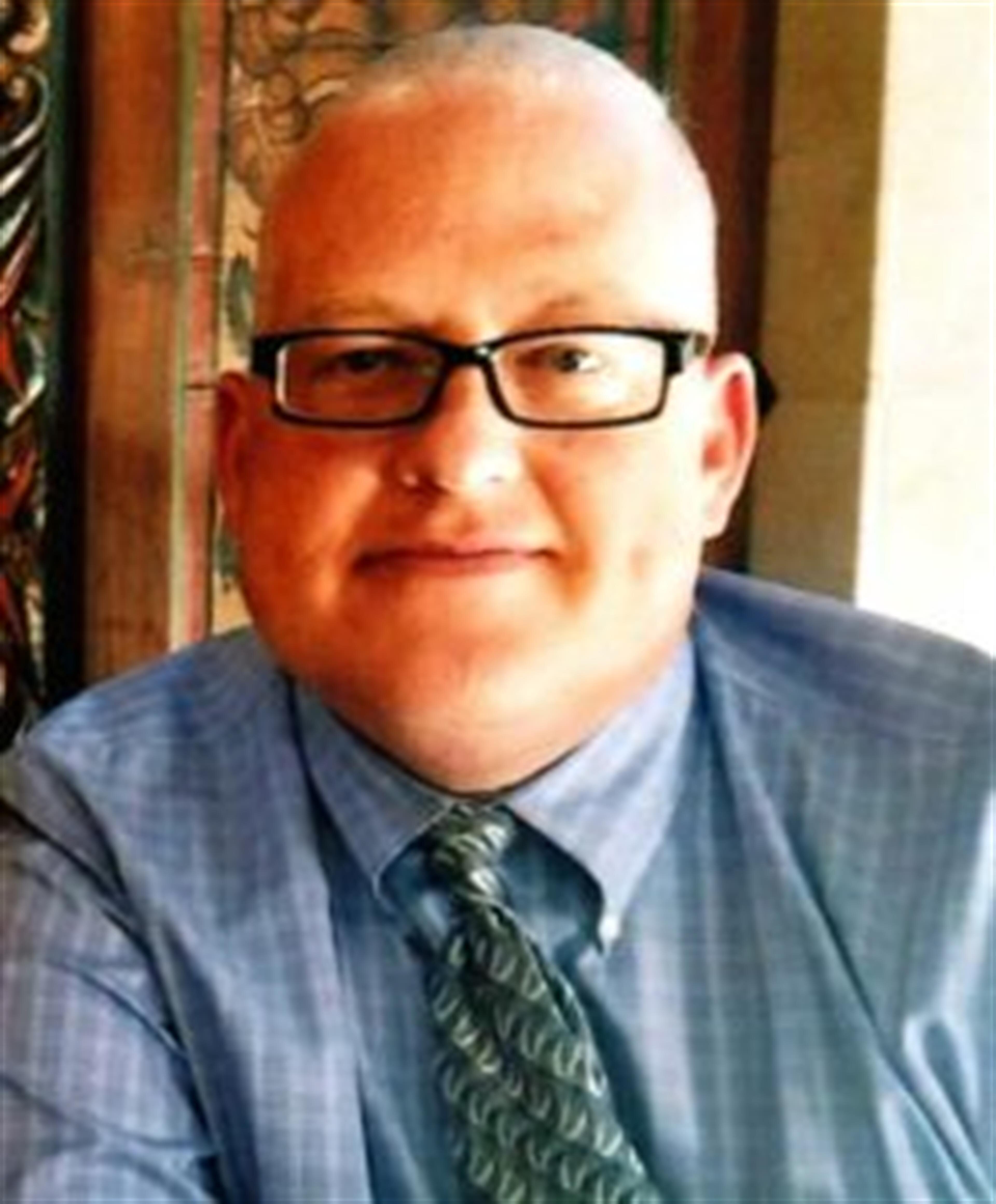 Curtis E. Renoe