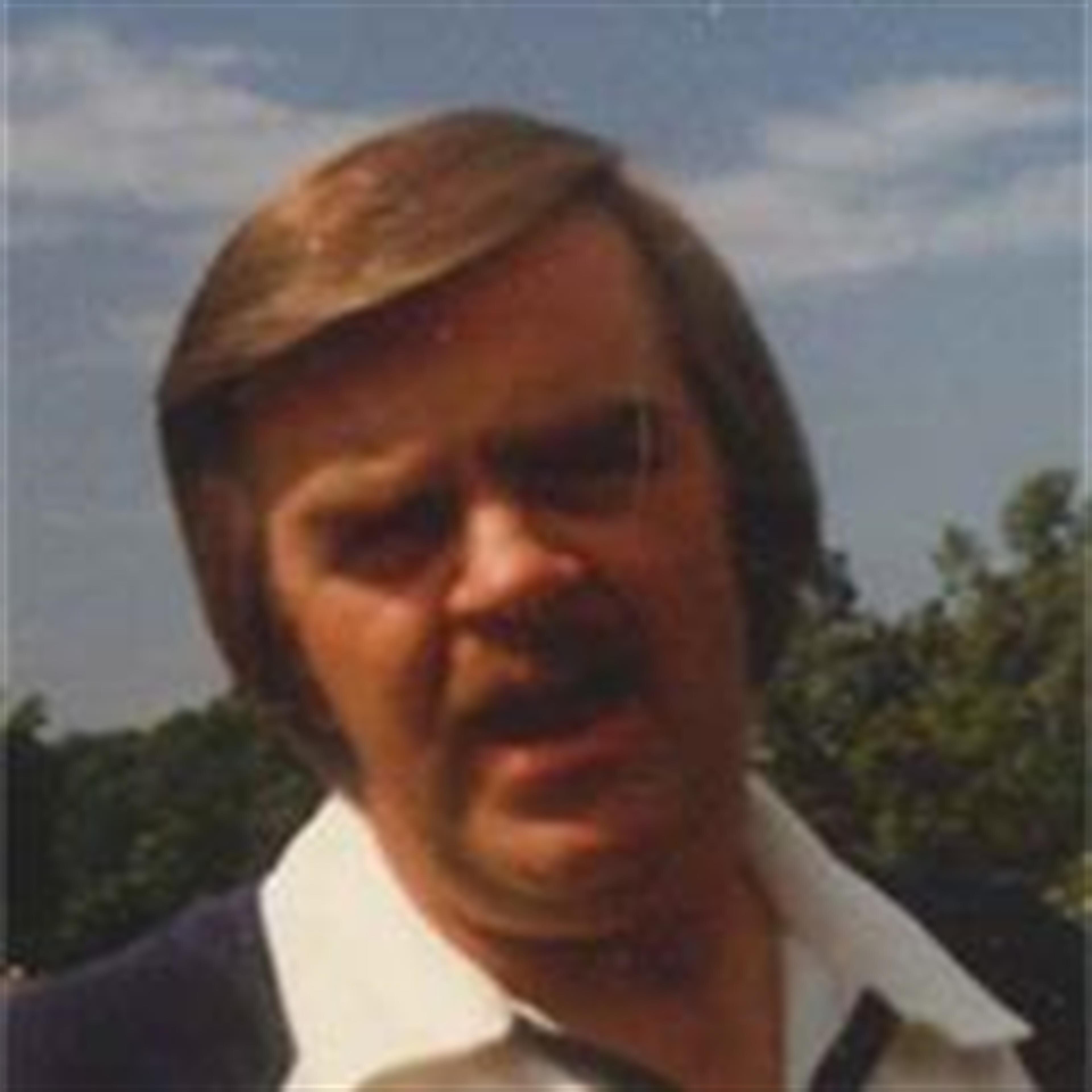 Thomas E. White