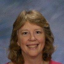 Regina "Reg" Poppell Brewster
