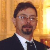 Lance E.  Ames