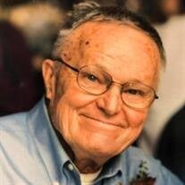 Raymond J. "Ray" May