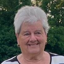 C. Elaine Travis