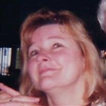 JUDITH E. NELSON