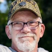 Mark E. Genson