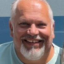 Thomas "Tom" E. Nader