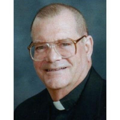 Rev. Denis E. White